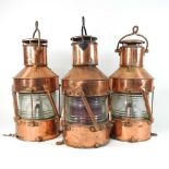 A set of three antique copper ship's lanterns