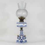 An early 20th century German porcelain oil lamp