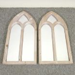 A pair of pine arched wall mirrors