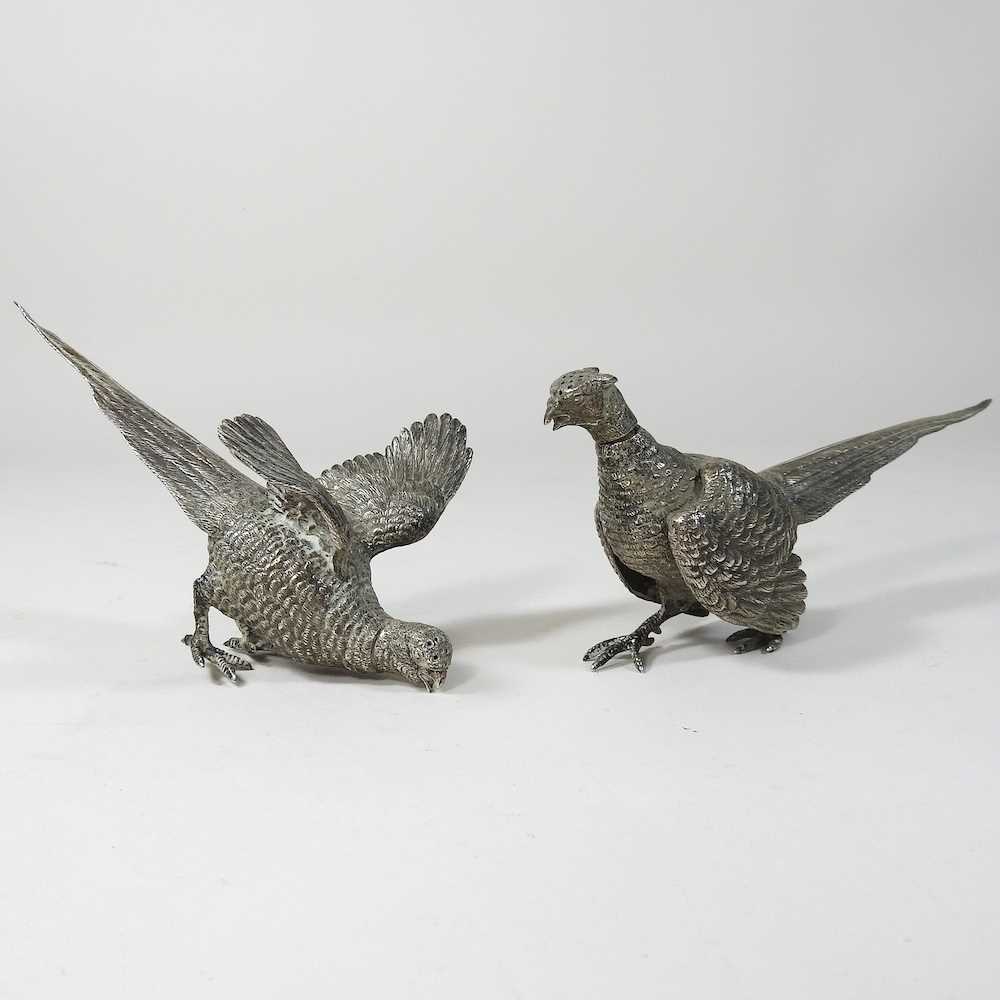 A pair of early 20th century silver peppers