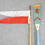 A painted wooden oar