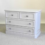 A grey painted chest of drawers