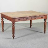 A Victorian oak writing table