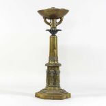An early 19th century brass lamp