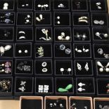 A collection of forty pairs of earrings