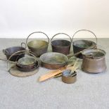 A collection of antique saucepans