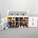 A painted wooden dolls house