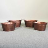 A set of four painted metal planters