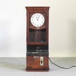 An early 20th century electric clocking-in machine