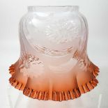 An amber glass frilled glass oil lamp shade