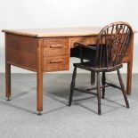 A mid 20th century desk with chair