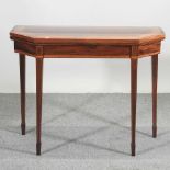 A George III mahogany and satinwood crossbanded card table