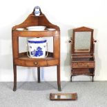 A George III mahogany corner washstand