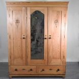 An antique pine armoire