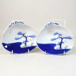 A pair of Japanese porcelain blue and white oyster plates