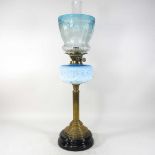 An 19th century brass and opaline oil lamp