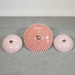 A pair of mid 20th century pink glass ceiling lights