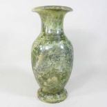 A carved stone oriental vase