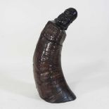 A carved horn Buddha