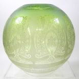 A green glass oil lamp shade