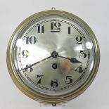 An early 20th century brass cased bulkhead clock