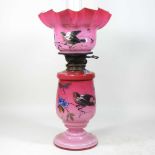 An 19th century French opaline glass oil lamp