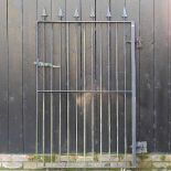 A hand forged iron garden gate