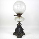 A Victorian cast iron oil lamp