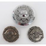 Three Various Commonwealth Plaid Brooches consisting plated, circular disk with thistle