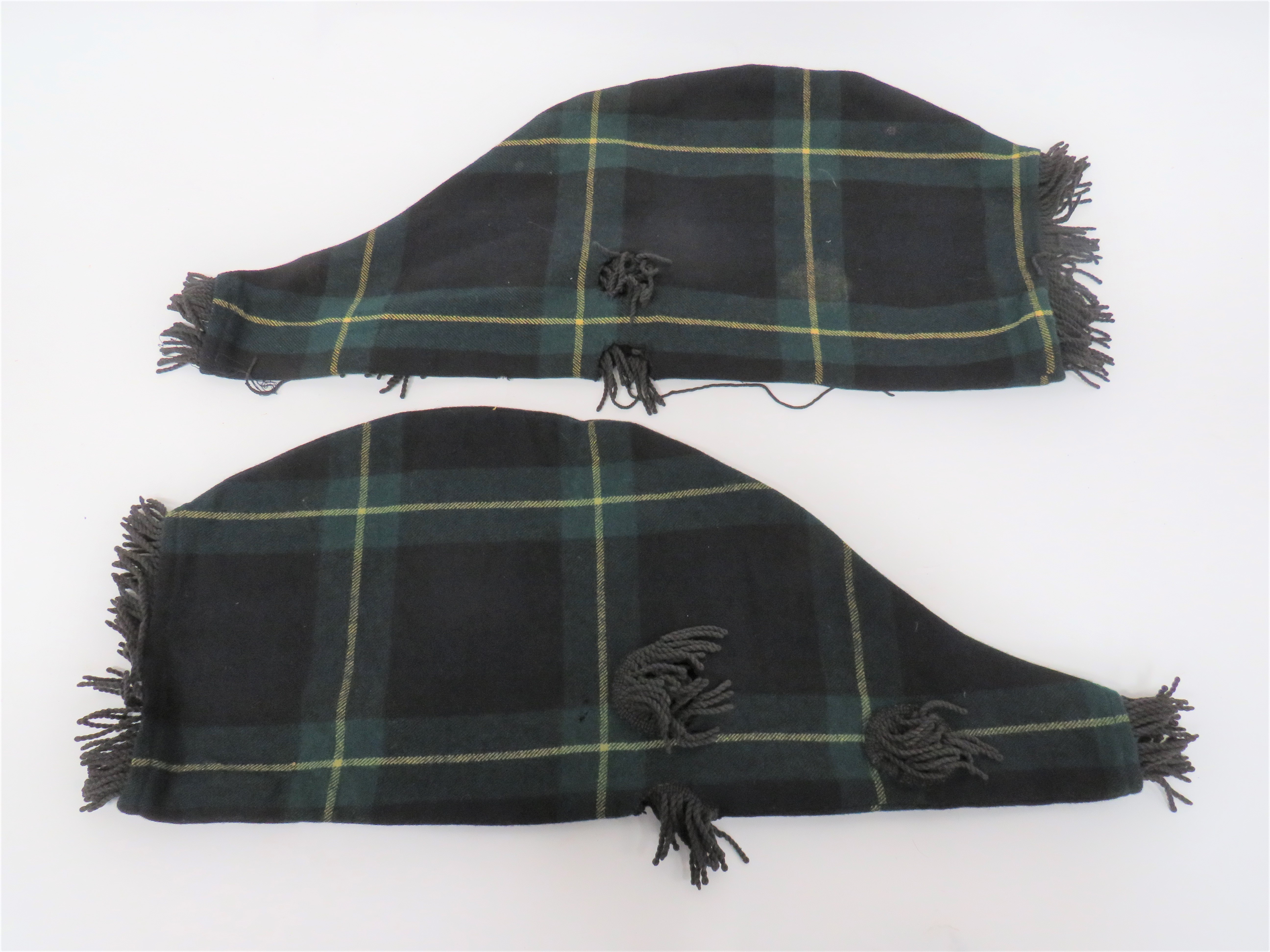 Two Gordon Highlanders Bagpipe Covers woollen, tartan bags with black fringe hole surrounds and