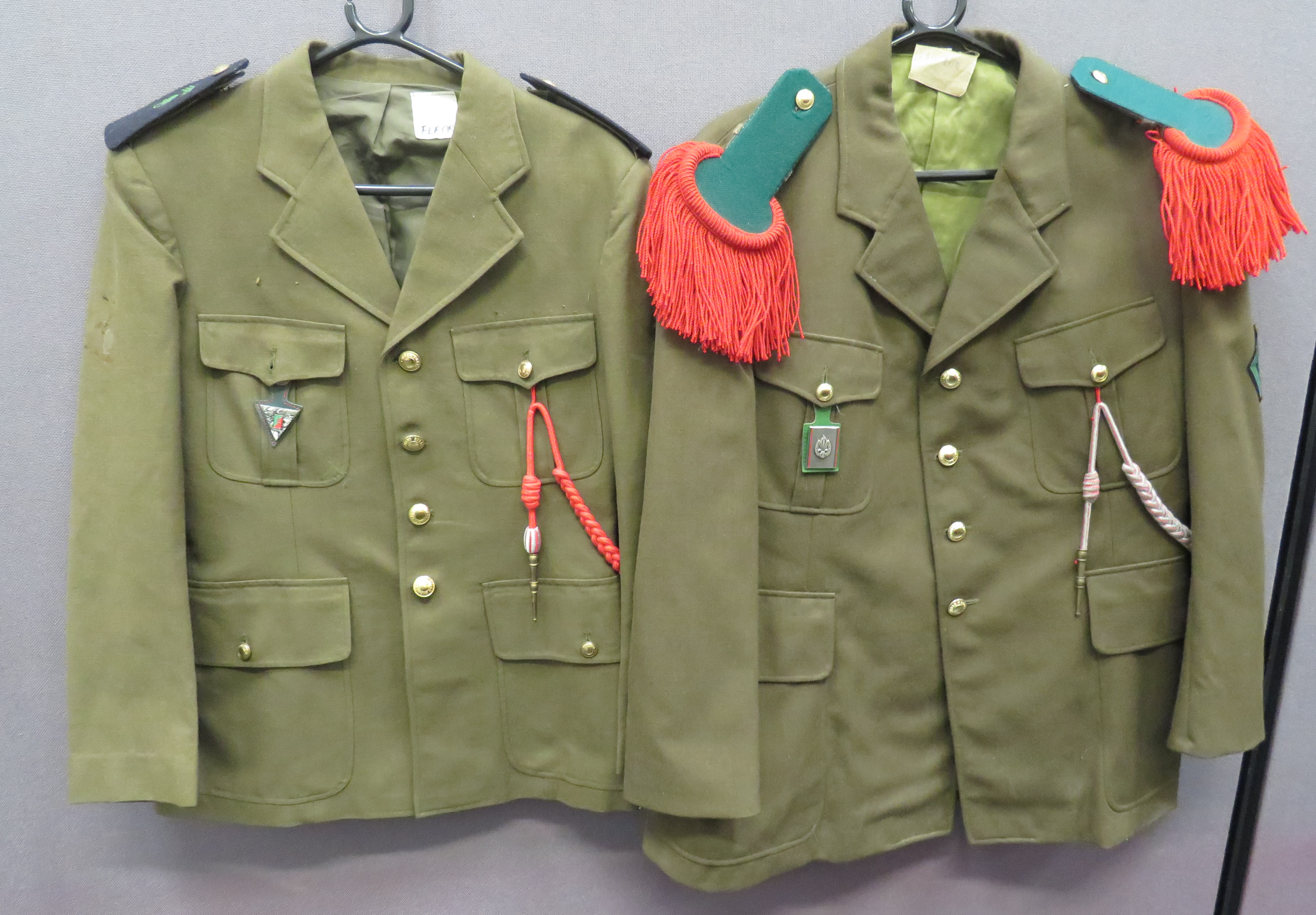Two French Foreign Legion Tunics consisting khaki, single breasted, open collar tunic.  Pleated