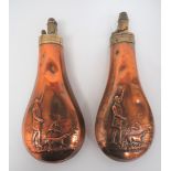 Pair of Copper and Brass Powder Flasks copper bodies with huntsman and hounds design.  Brass tops