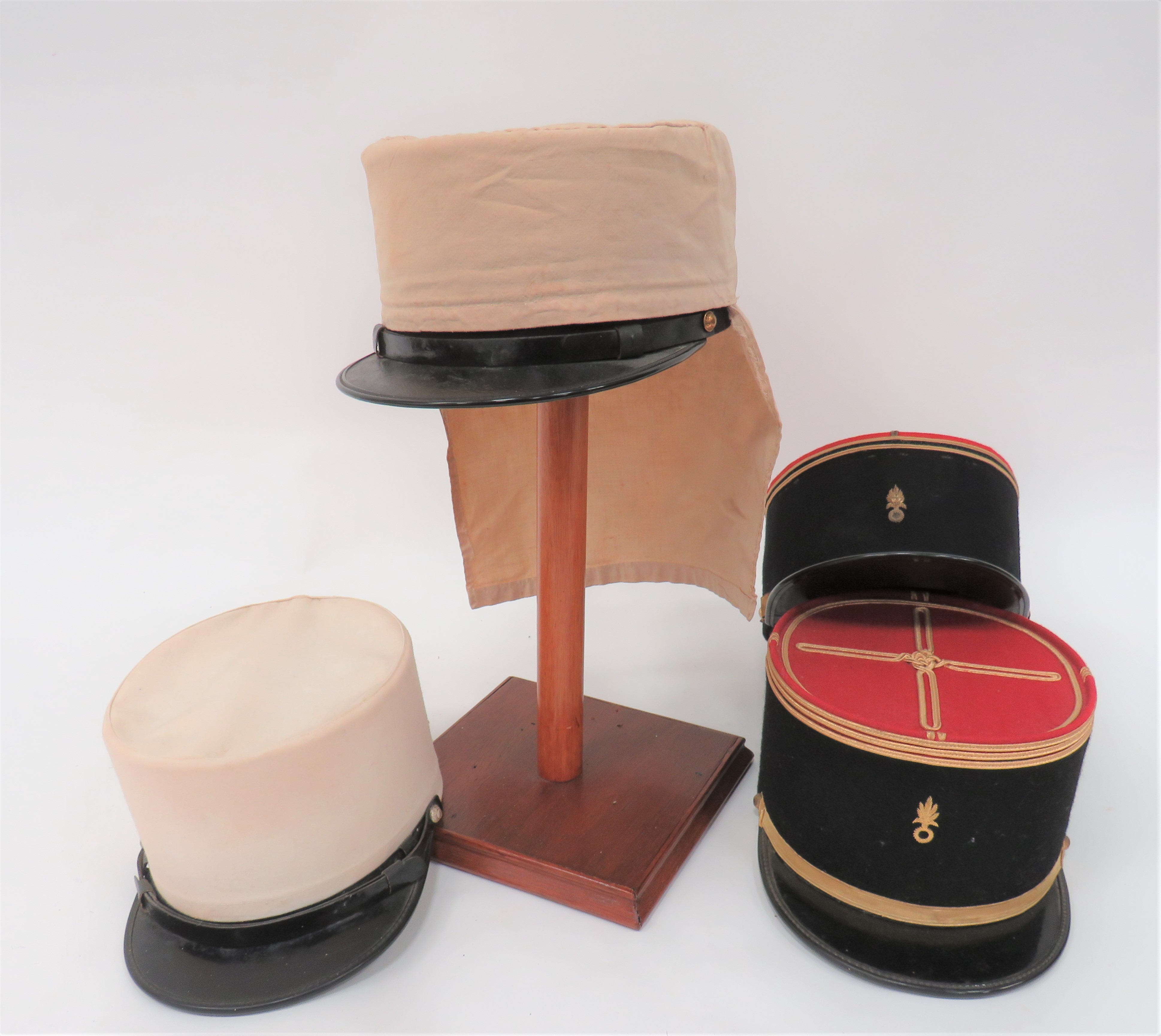 Three Various French Foreign Legion Kepis  consisting dark blue body with red crown.  Black patent