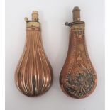 Two Victorian Powder Flasks consisting fluted, bag shape example.  Brass top with exposed spring.