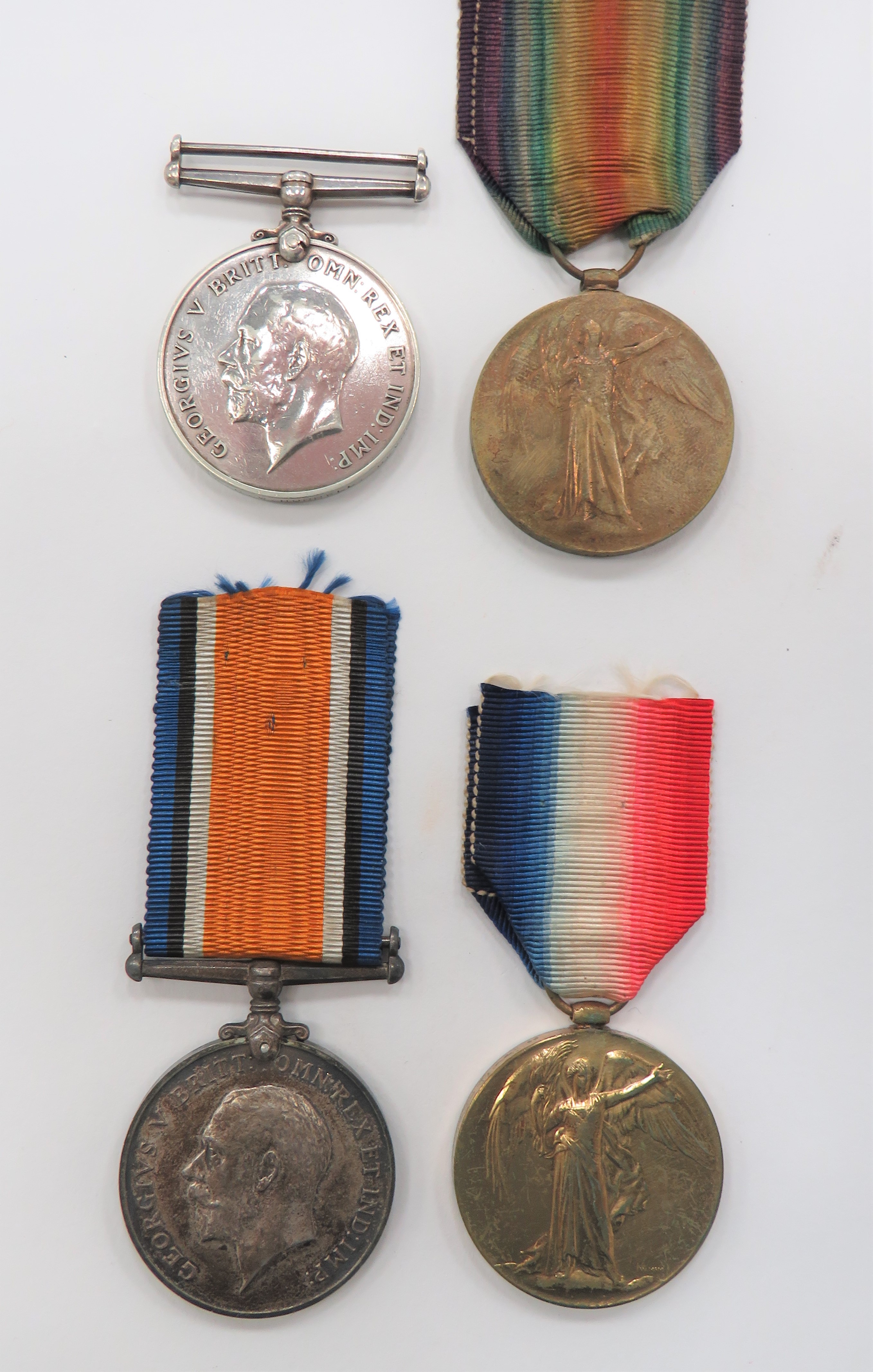 Two WW1 Line Infantry Medal Pairs consisting silver War medal and Victory medals named ""202752 Pte
