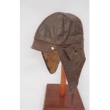 Interwar Period Leather Flying Helmet brown leather, multi panel helmet with small peak.  Roll up,