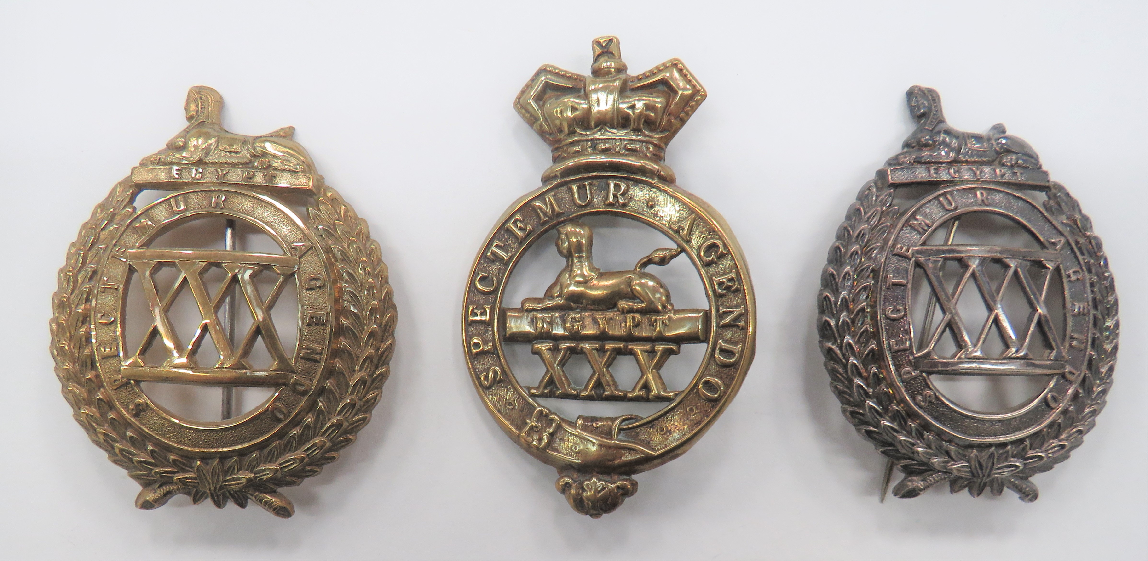 Three Various 30th Foot East Lancashire Badges consisting brass, Vic crown Glengarry badge.