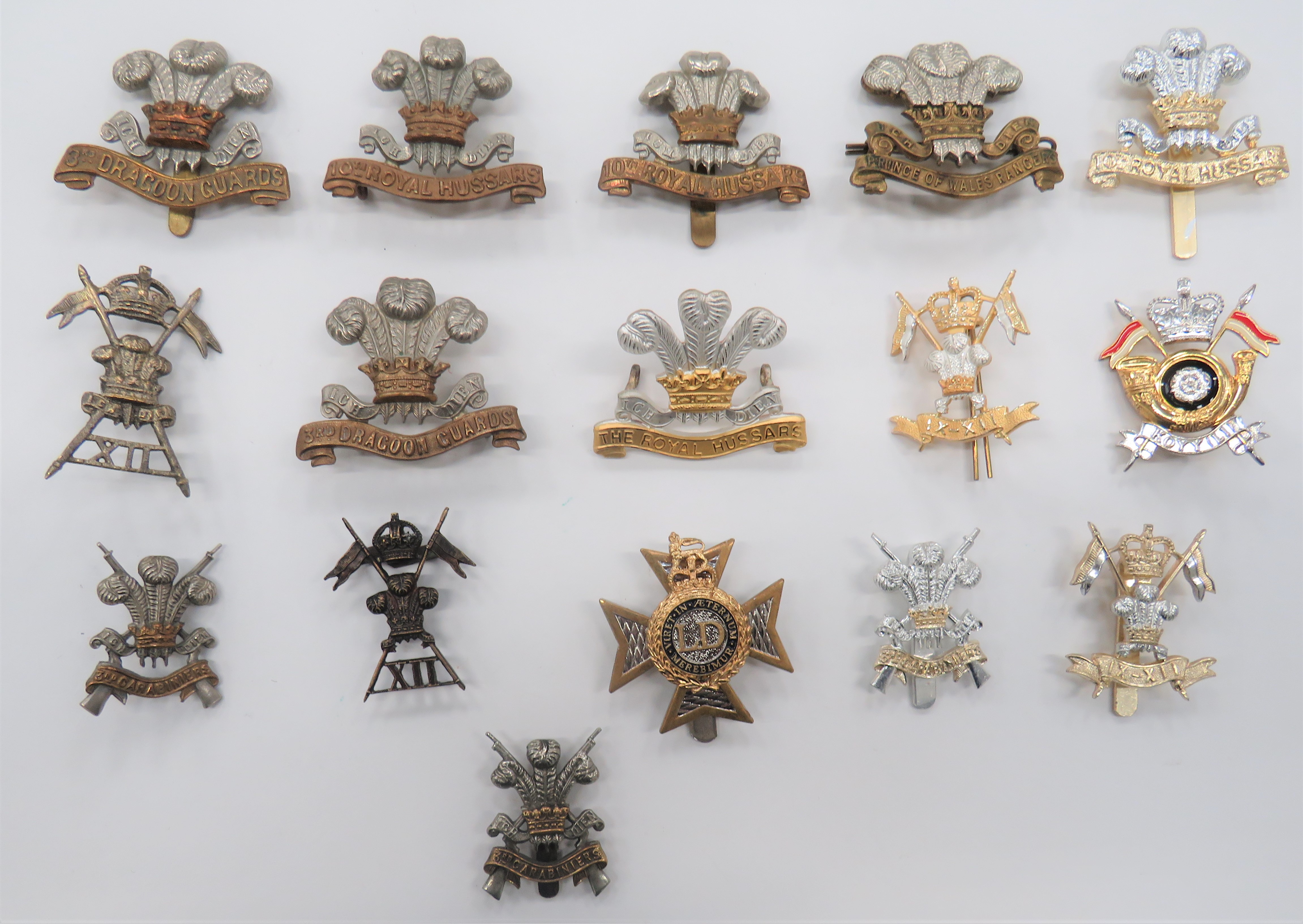 British Cavalry Cap Badges including blackened, KC 12th Lancers (blades) ... Silvered and gilt The