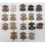 Welsh Regiment Cap Badges including WW2 plastic economy (blades) ... Blackened Welsh (lugs) ...