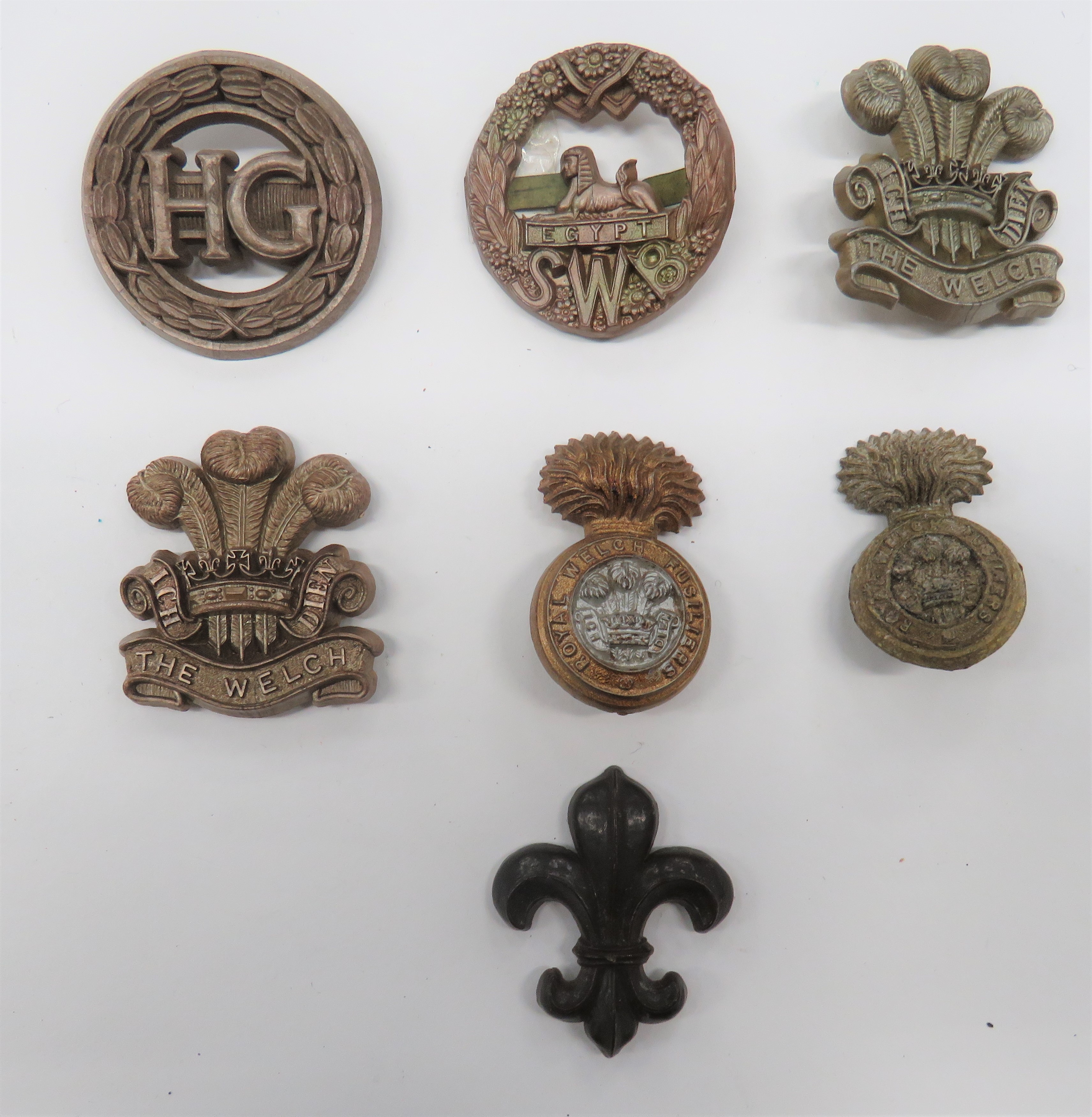 WW2 Plastic Economy Cap Badges including South Wales Borders (blades) ... The Welch (blades) ...