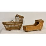 A vintage pine dolls rocking cradle, 17¾in. (45.2cm.), together with a wicker version. (2)