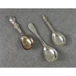 Three silver caddy spoons, to include a George III fiddle pattern spoon by John & Henry Lias, London