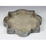 A shaped lead bird bath, of flower head form with right angles, 12 3/8in. (31.5cm.) at widest.