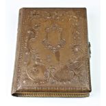 A well preserved Victorian embossed musical photograph album, empty, tested and working.