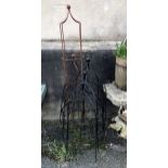 A set of three black garden obelisks, together with two further obelisk frames with rusted patina,