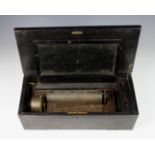 A cylindrical music box for restoration or spares.