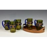 Art glass - a set of five modernist glass & copper mugs, 1960s-70s, the amber glass mugs with blue