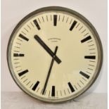 A large vintage Synchronome Electric wall clock, made in England, 1960s, anodised brass case, used