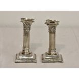 A pair of late Victorian silver dwarf corinthian column candlesticks, Thomas Hayes, Birmingham,