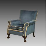 A Victorian armchair, the square back, scroll arms and squab cushion upholstered in light blue